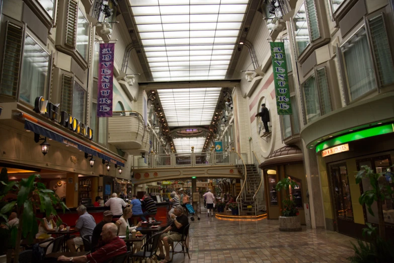 this is an empty shopping mall with people walking around