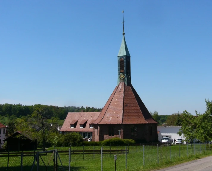 a big church building on a grassy lot