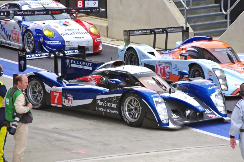 a line of cars lined up on the track