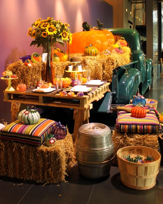 a wooden wagon filled with hay and various decorations