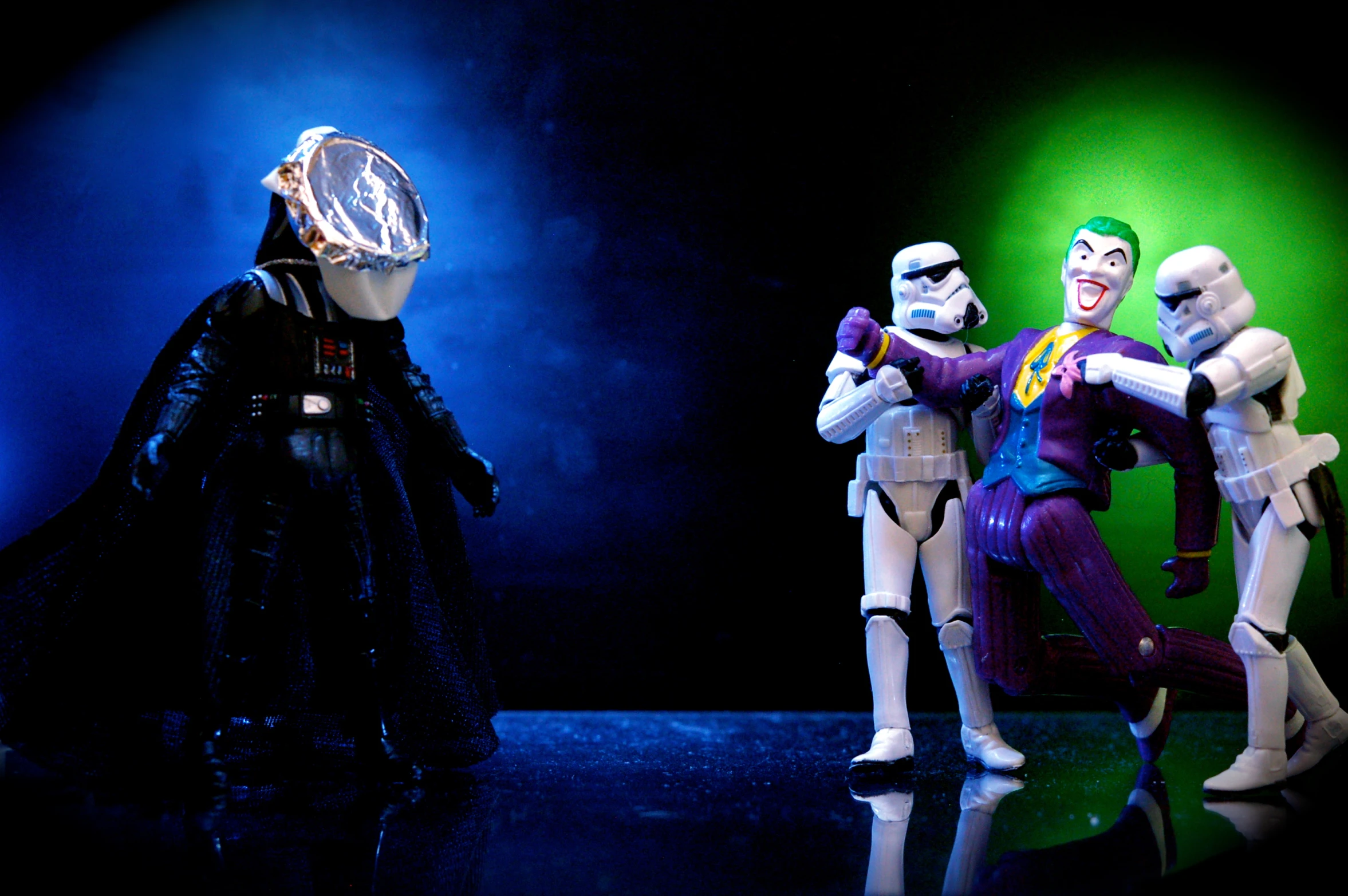 a toy star wars scene with three toy action figures