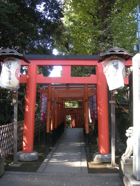 red gates and lanterns set up over the walkway