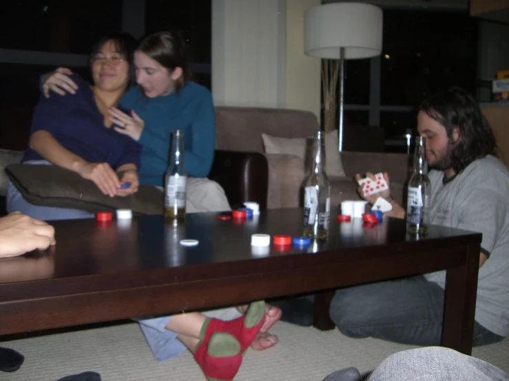 a group of people are seated around a table