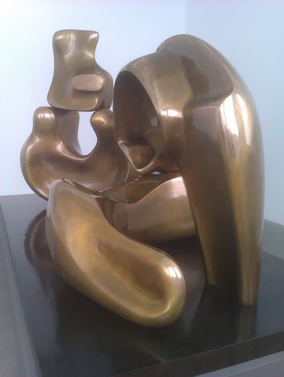 a golden sculpture sitting on top of a table