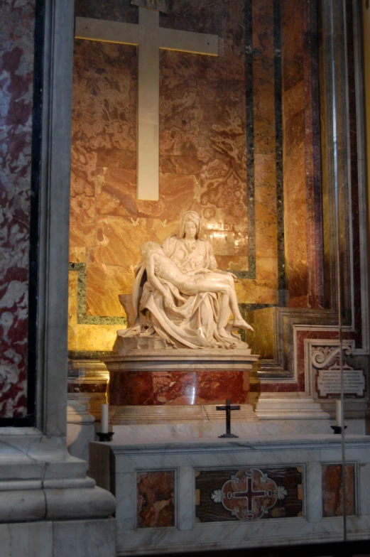 a statue of a person sitting on top of a white bench