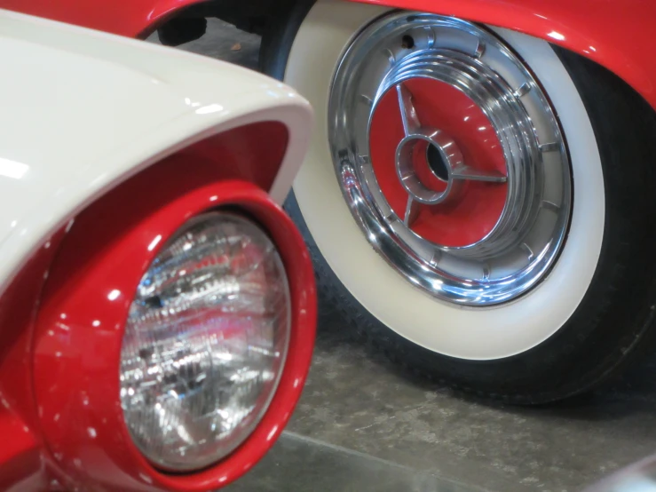 a white and red car with its fender turned