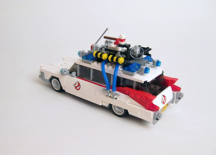 a lego fire truck on a white surface