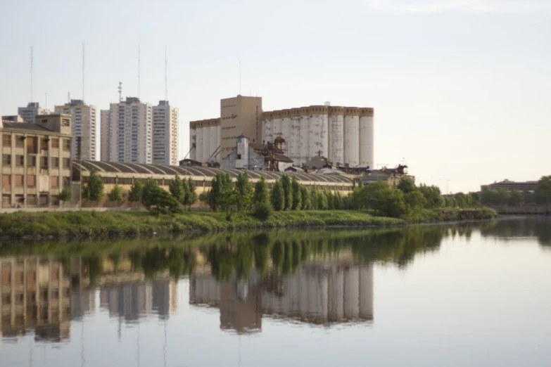 a body of water in front of large building