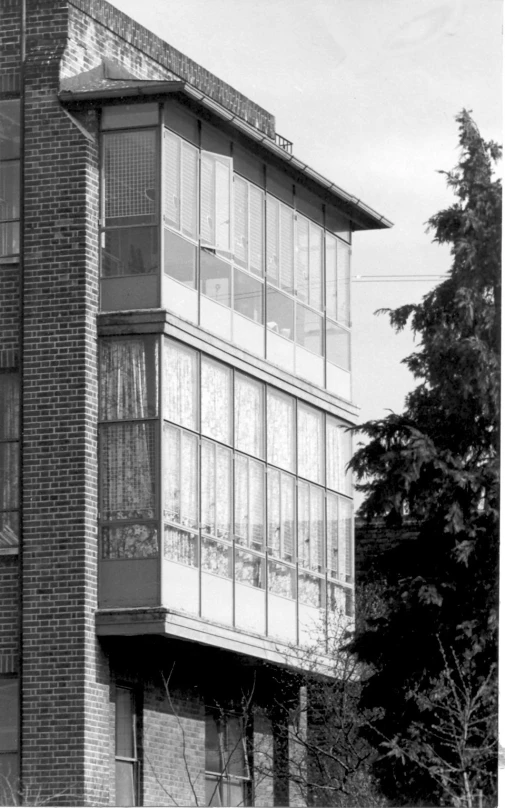 the building is tall with many windows on it