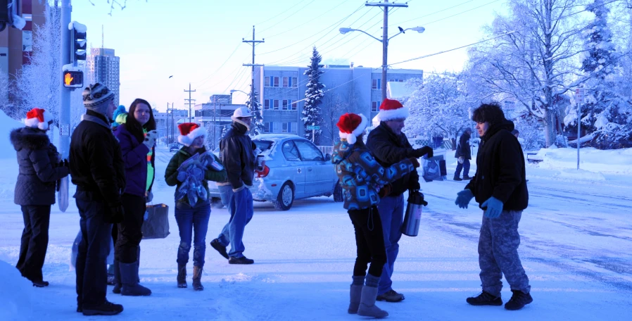 people in warm clothes on a snowy street