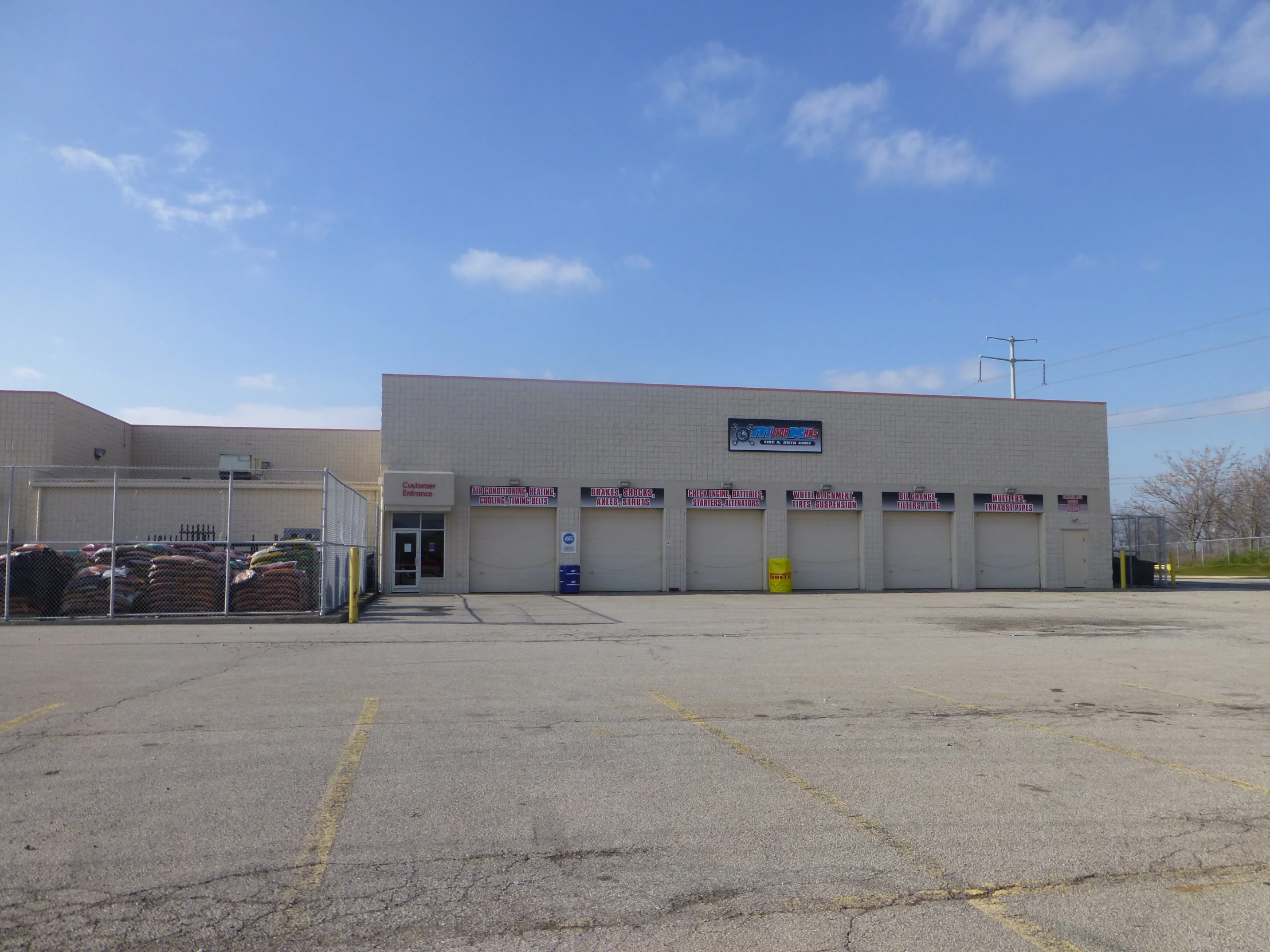 a building that has a parking lot and store