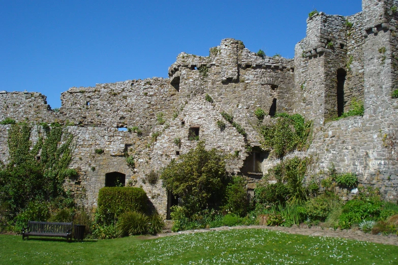 a large castle structure with several windows and a fence