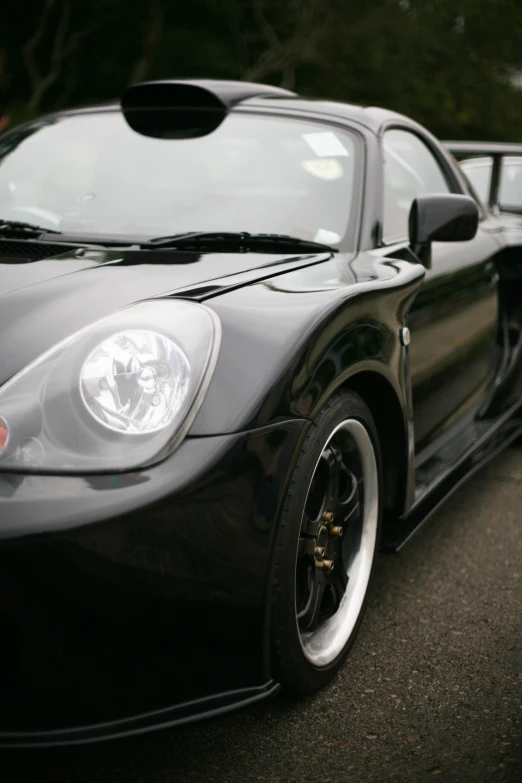 the back of a sports car parked in a parking lot