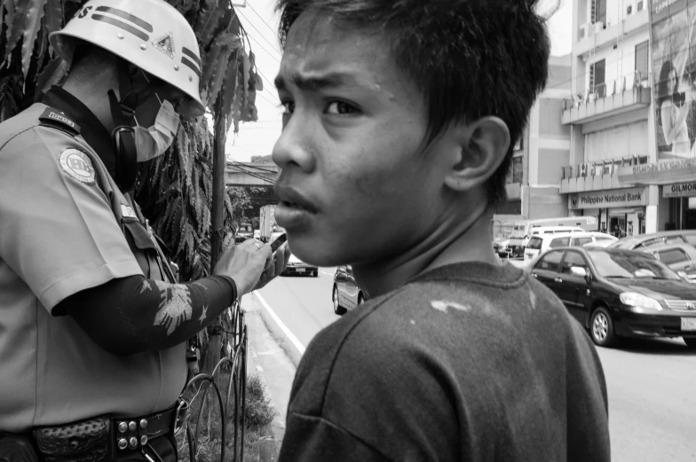 a police officer with a face mask painting on a man