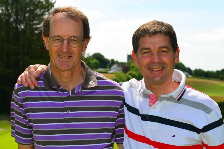 a couple of men standing next to each other