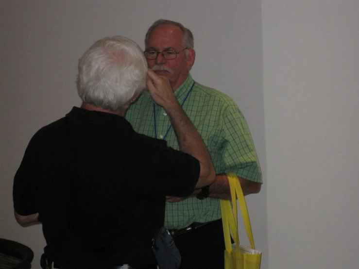 a man and woman in black looking at each other