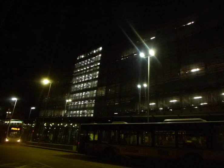 an image of bus at night in a city