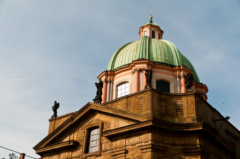 a dome top of a building with a clock in it