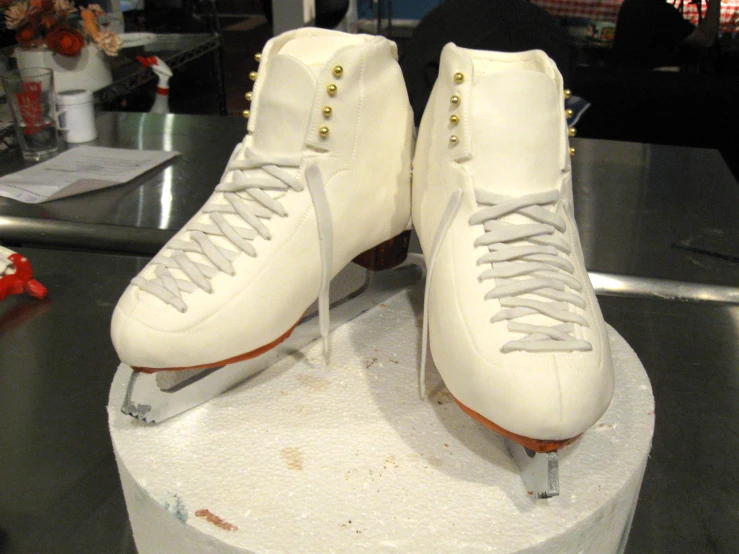 a pair of white roller blades on display in a shop