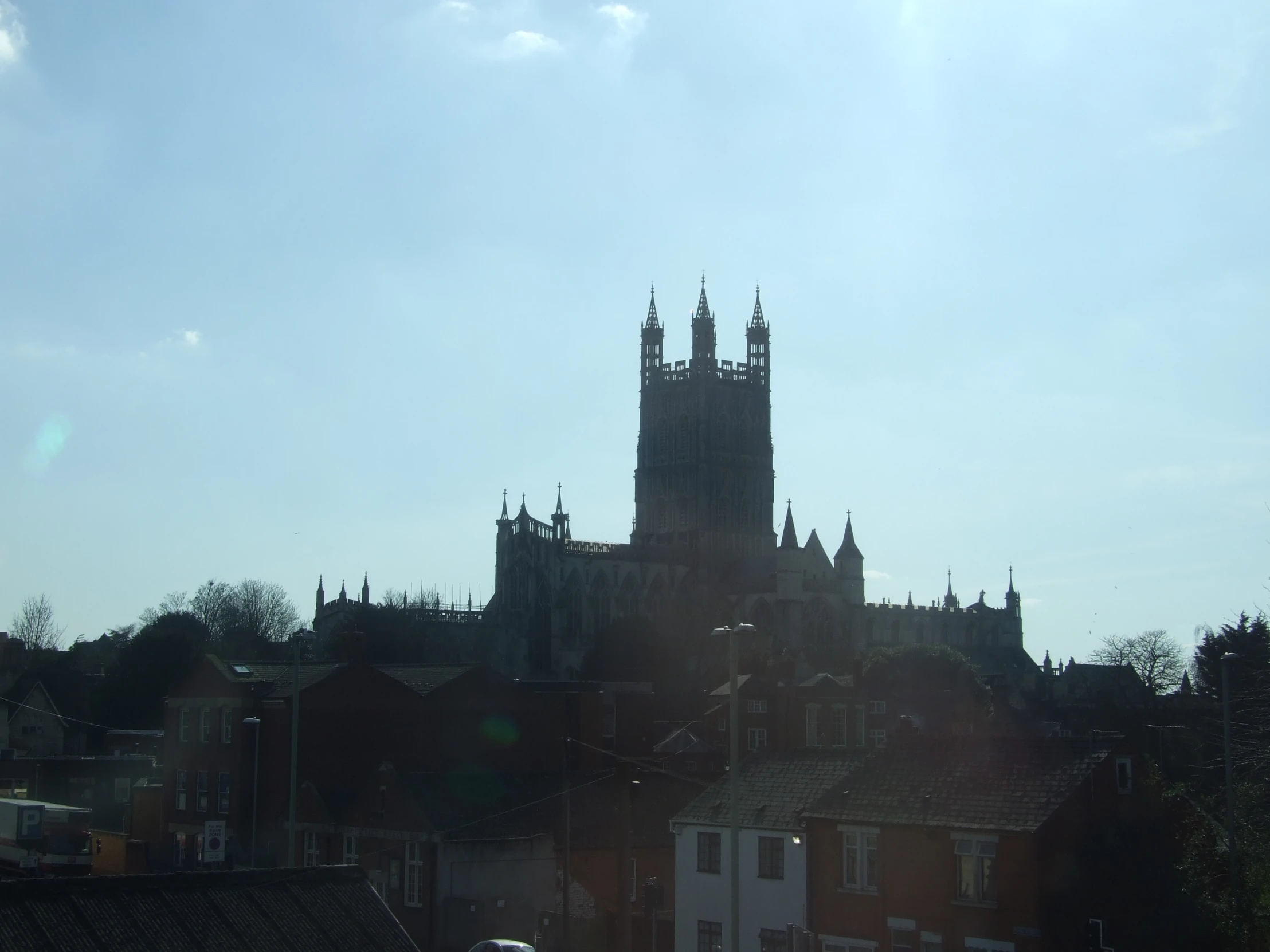 a castle type structure rises high above the city