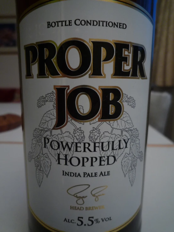 a bottle of proper job sitting on a table