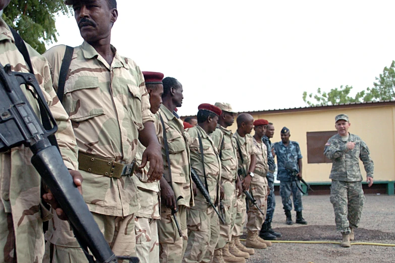 a group of military men in uniform lined up