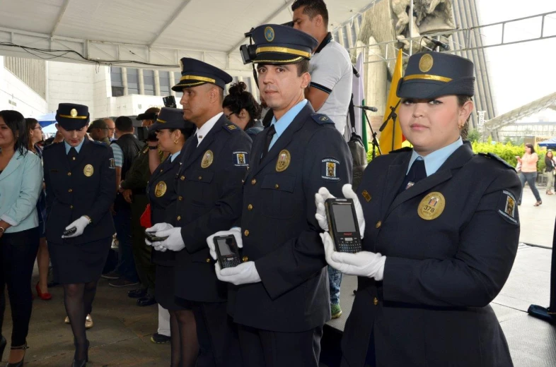 police officers at a public gathering and a small crowd