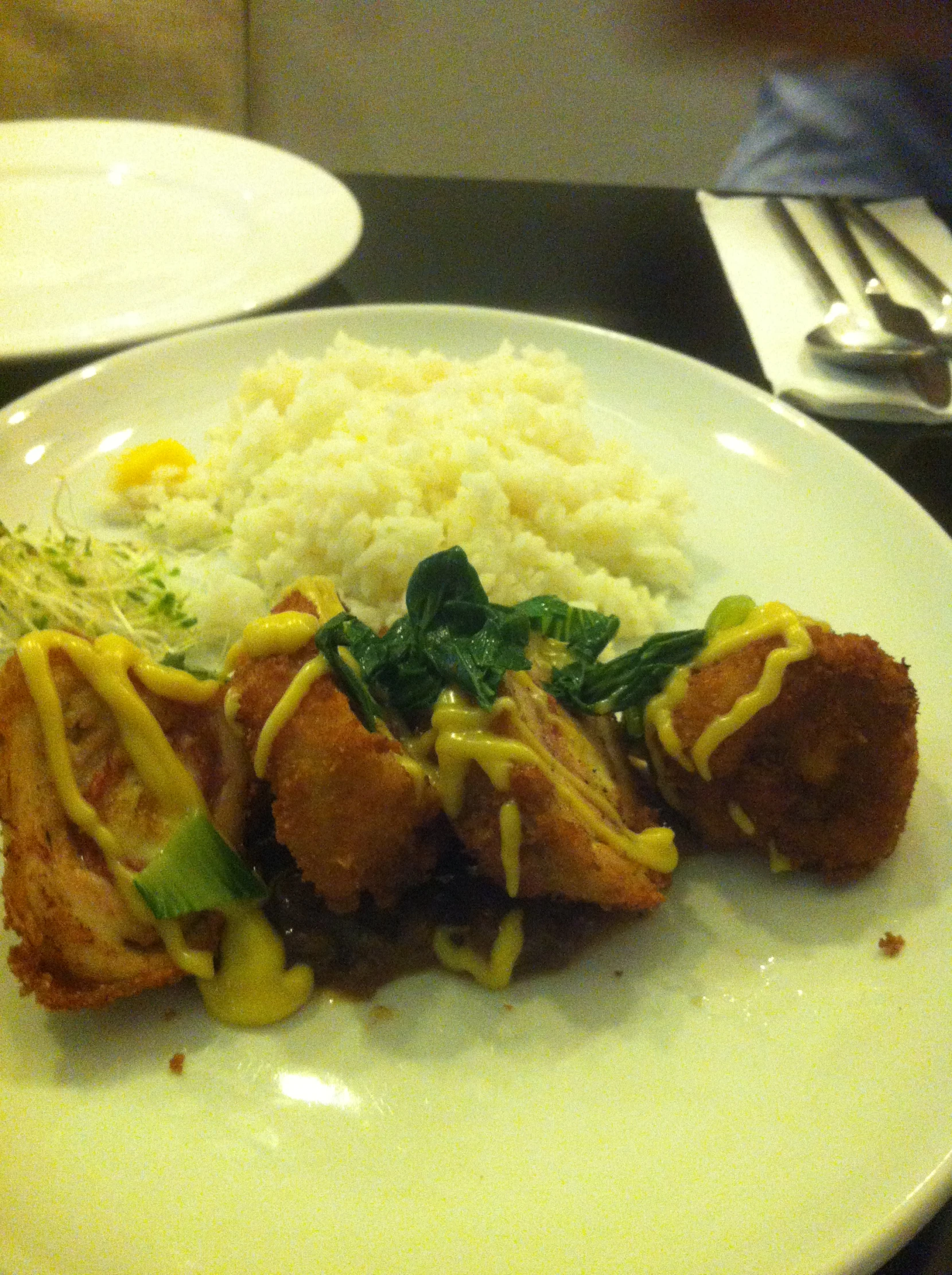 a white plate with food on it and a fork