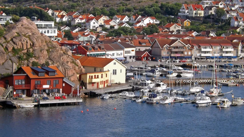 the boats are docked in the water at the pier