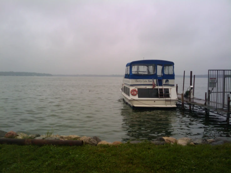 a boat with passengers sits at the dock