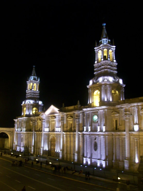 an old building in a large city by night