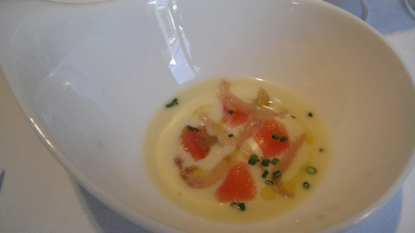 some kind of food in a white bowl on a table