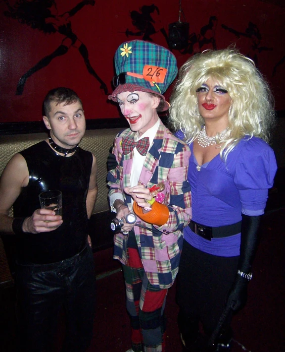 a woman with her face painted next to two men