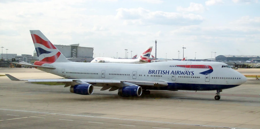 a big jumbo jetliner on the runway at an airport