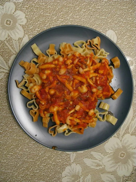 a silver plate that has some noodles on it