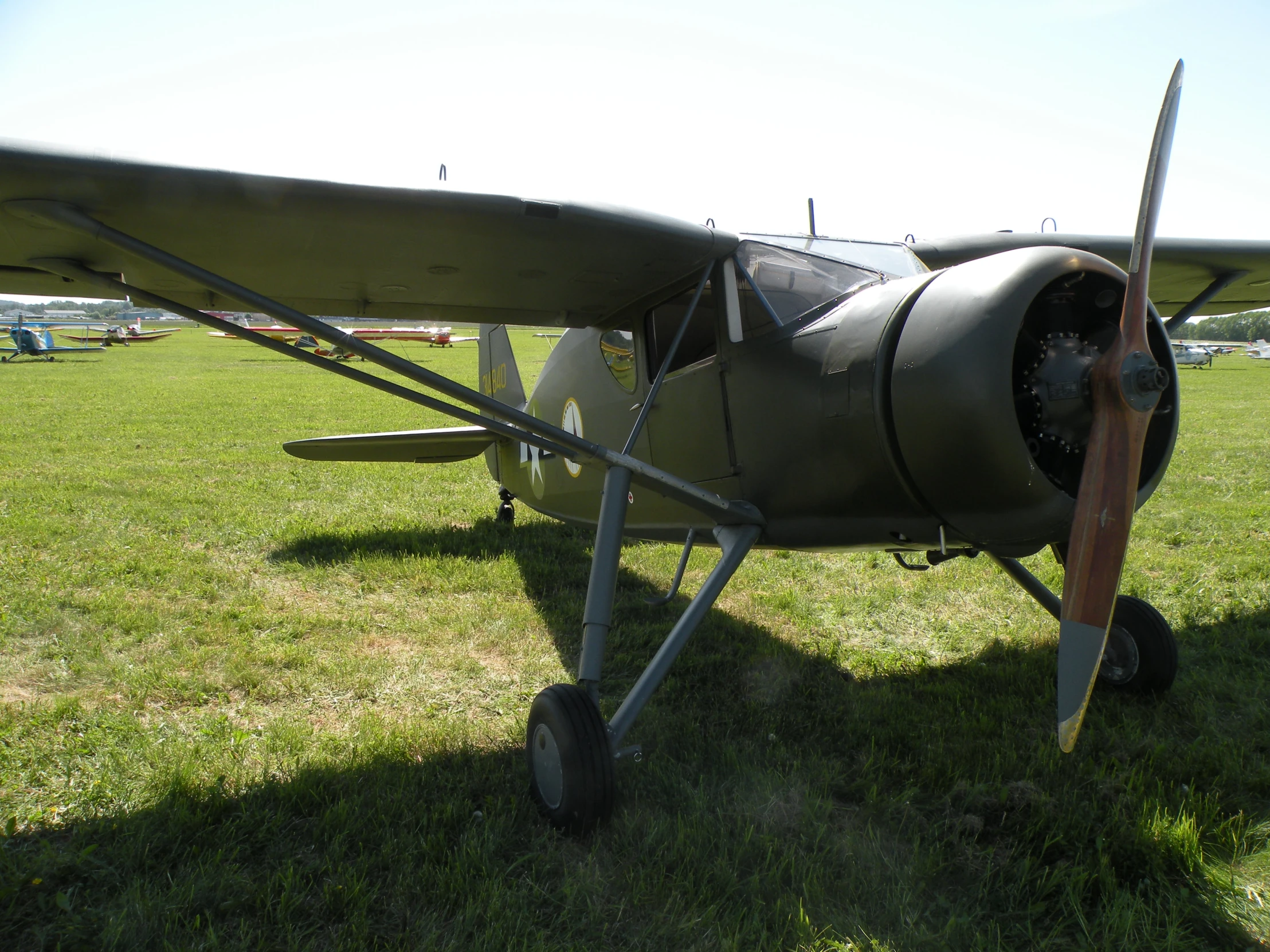 an old plane that is in the grass