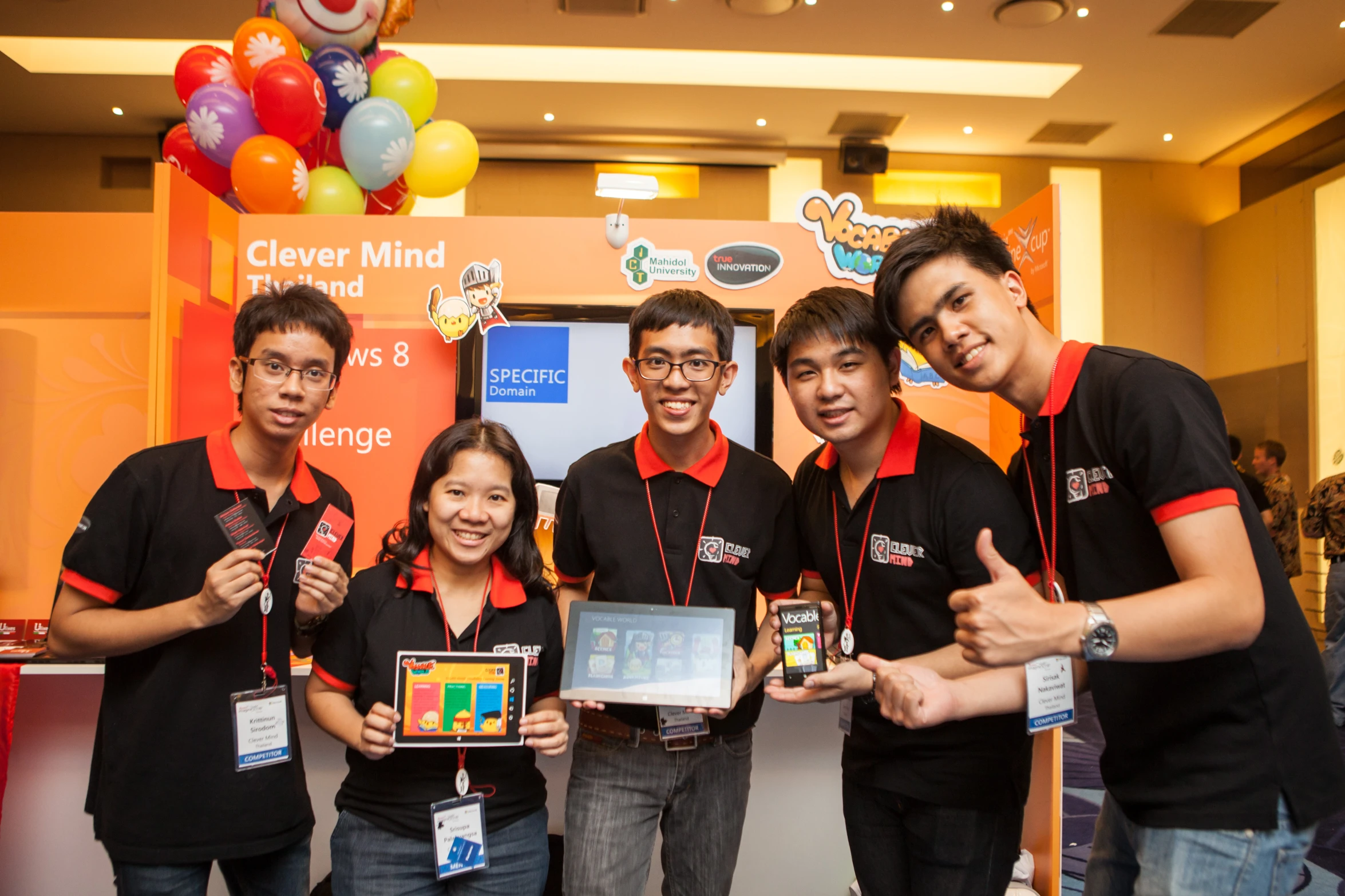 group of young people with cellphones at event