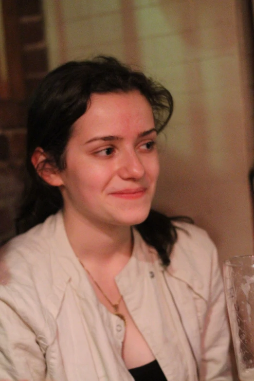 a woman is staring at the camera while smiling