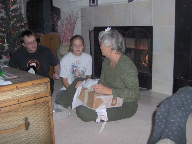 there is a family sitting in the living room