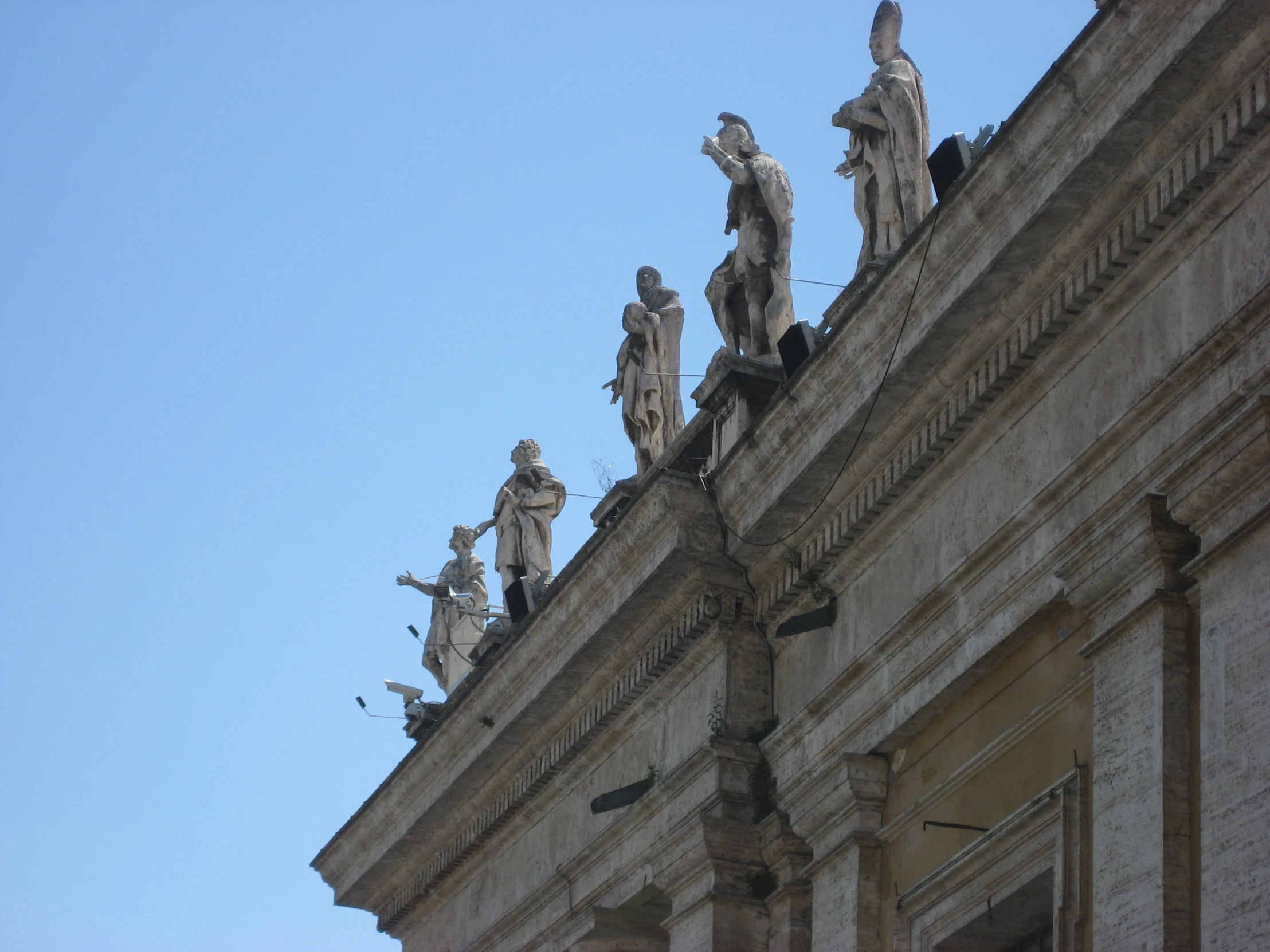 a close up s of statues on top of a building
