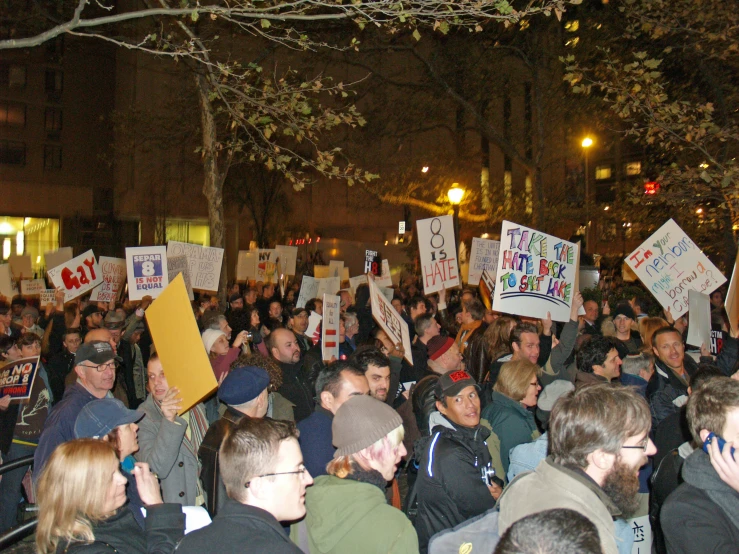 a group of people who are holding signs