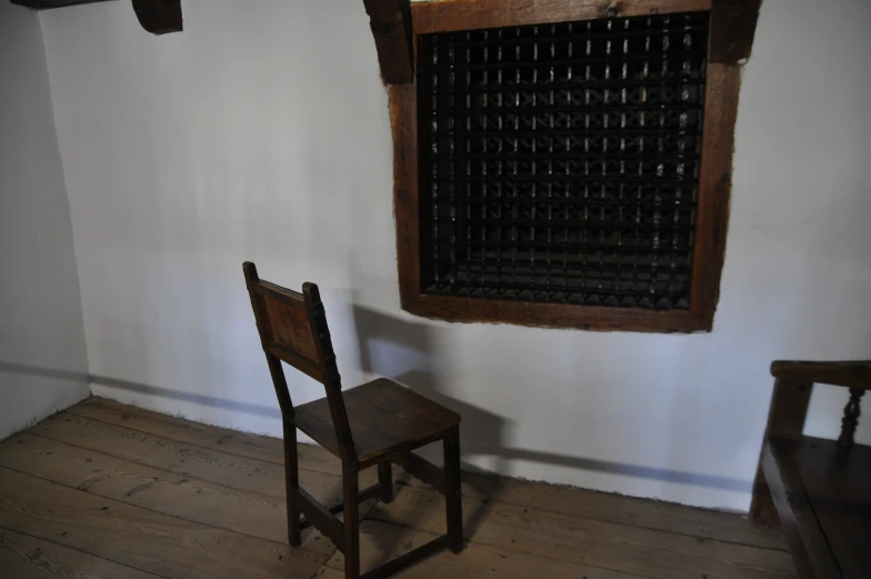 an old chair sitting next to a window