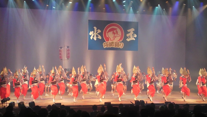 a group of performers on stage performing on a show