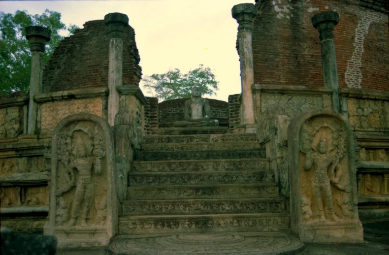 an ancient building with carved steps leading to the top