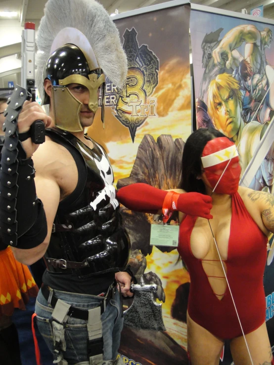 a couple of cosplaying costumes at an expo