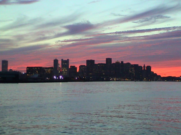 the skyline with buildings in the distance at night