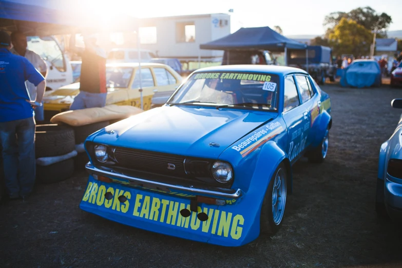 an image of an older car at an antique race