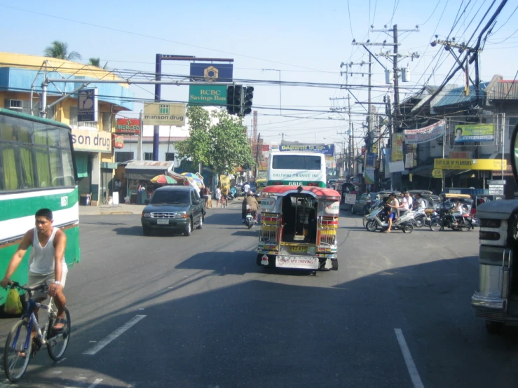 a large street full of people and some buses