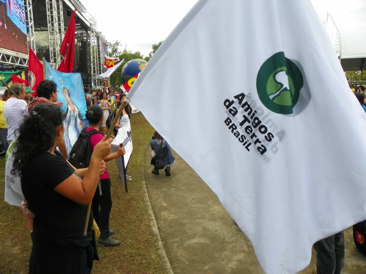 a group of people standing around and holding banners