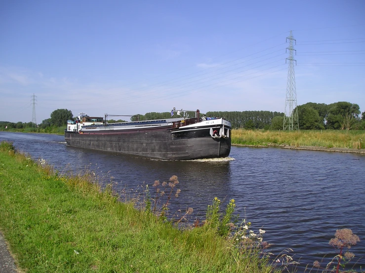 a large boat is going down a river